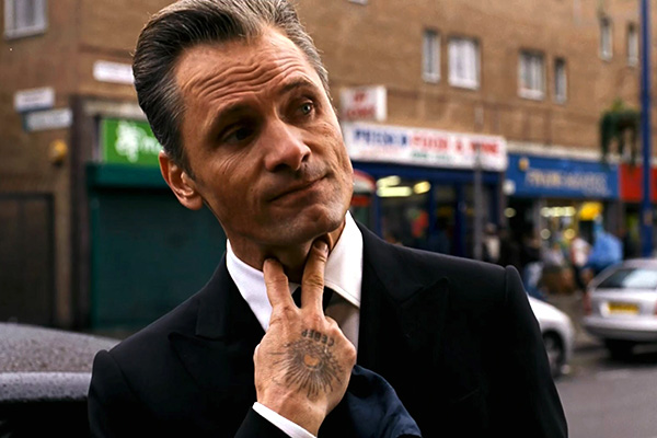 Here is Viggo Mortensen at his most menacing - covered in tattoos as a London mob boss. The actor plays the Eastern European leader of one of London's most notorious organized crime families in Eastern Promises. He soon butts heads with Anna, played by Naomi Watts, an innocent midwife who accidentally uncovers potential evidence against the crime family. The movie, reuniting Viggo with director David Cronenberg, also stars Vincent Cassel. Pictured: Viggo Mortensen Ref: SPL1134 Splash News and Pictures Los Angeles:310-821-2666 New York:212-619-2666 London:870-934-2666 photodesk@splashnews.com Splash News and Picture Agency does not claim any Copyright or License in the attached material. Any downloading fees charged by Splash are for Splash's services only, and do not, nor are they intended to, convey to the user any Copyright or License in the material. By publishing this material , the user expressly agrees to indemnify and to hold Splash harmless from any claims, demands, or causes of action arising out of or connected in any way with user's publication of the material.